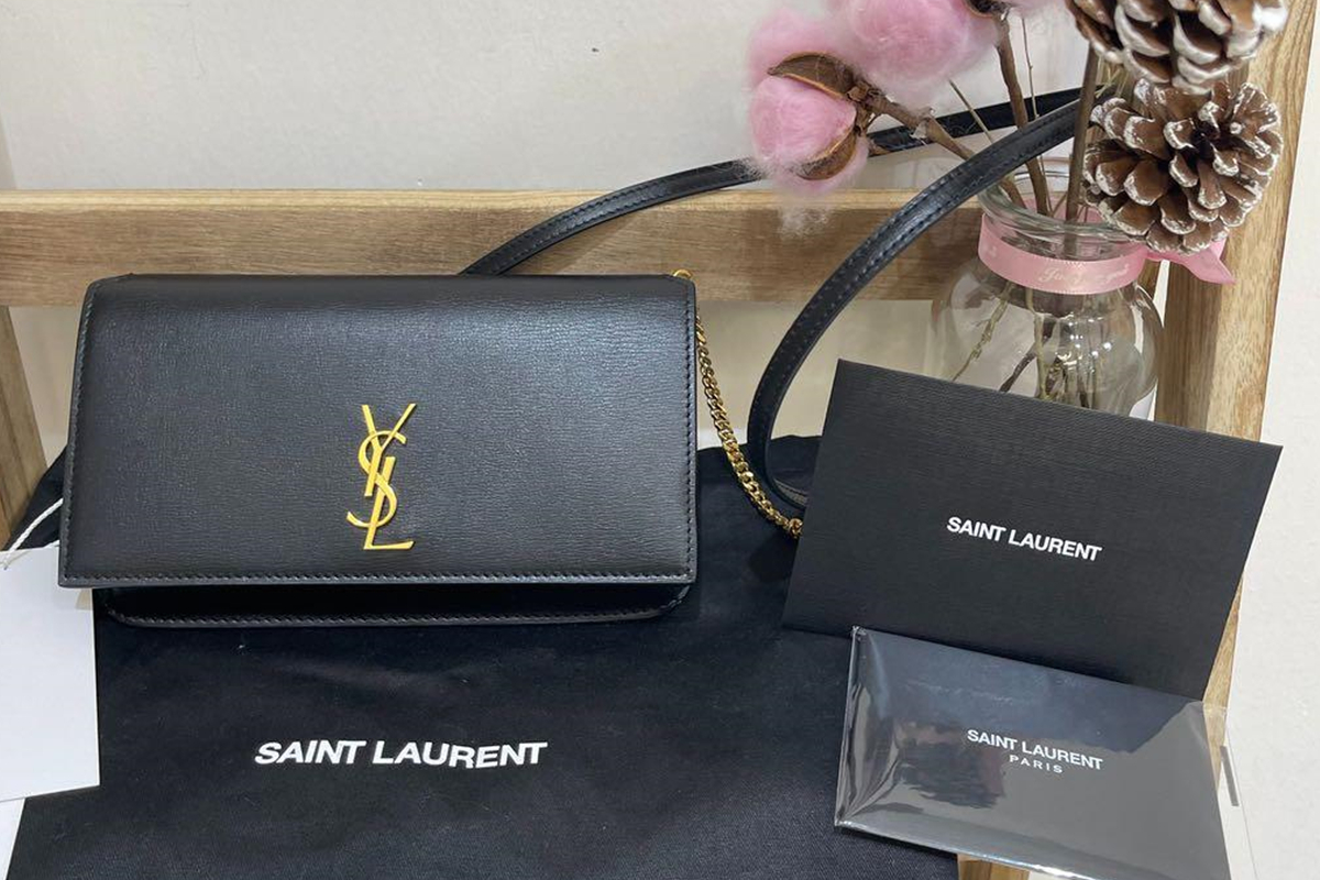 A Must-Have: Saint Laurent Leather Phone Holder.